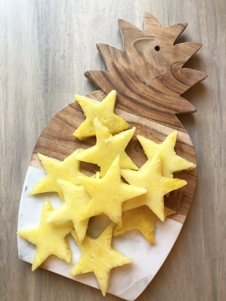 how to cut a pineapple into stars; holiday Christmas cheese tray for